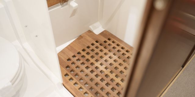 Teak floor grate in shower